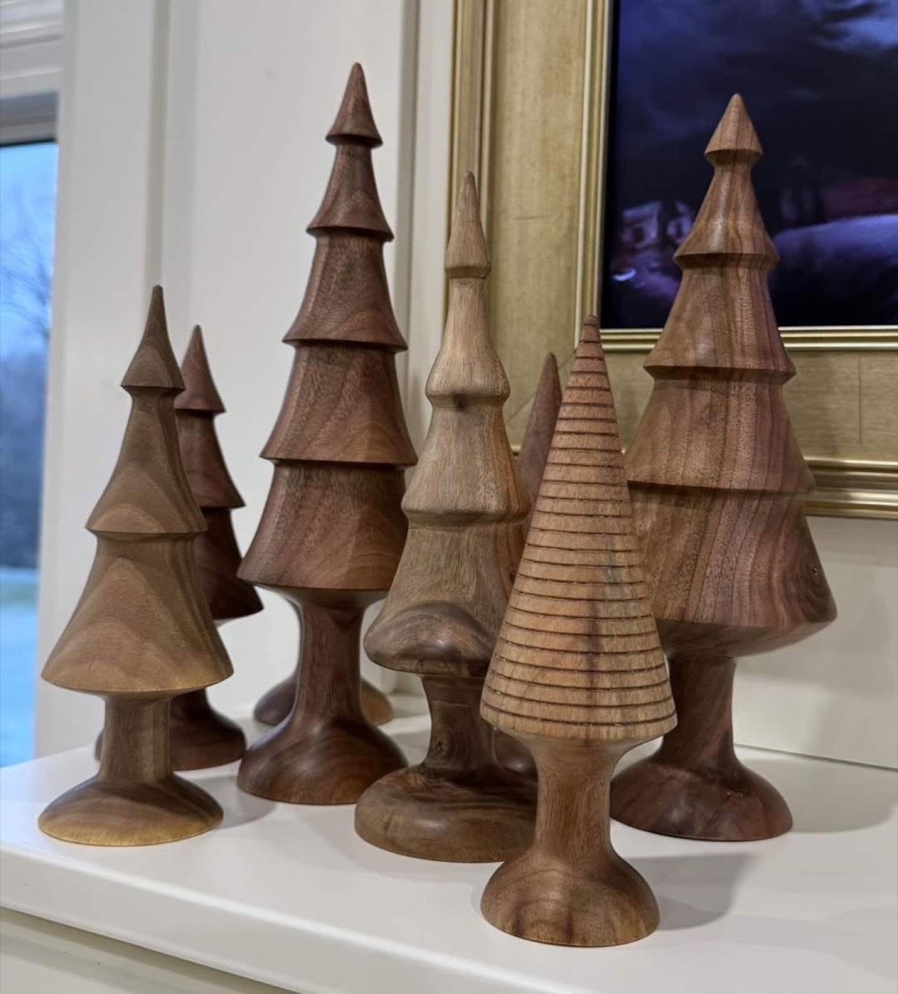 A group of tiered walnut decorative trees